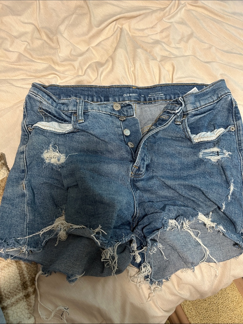 Old Navy Ripped Denim Cutoff Shorts in Medium Blue